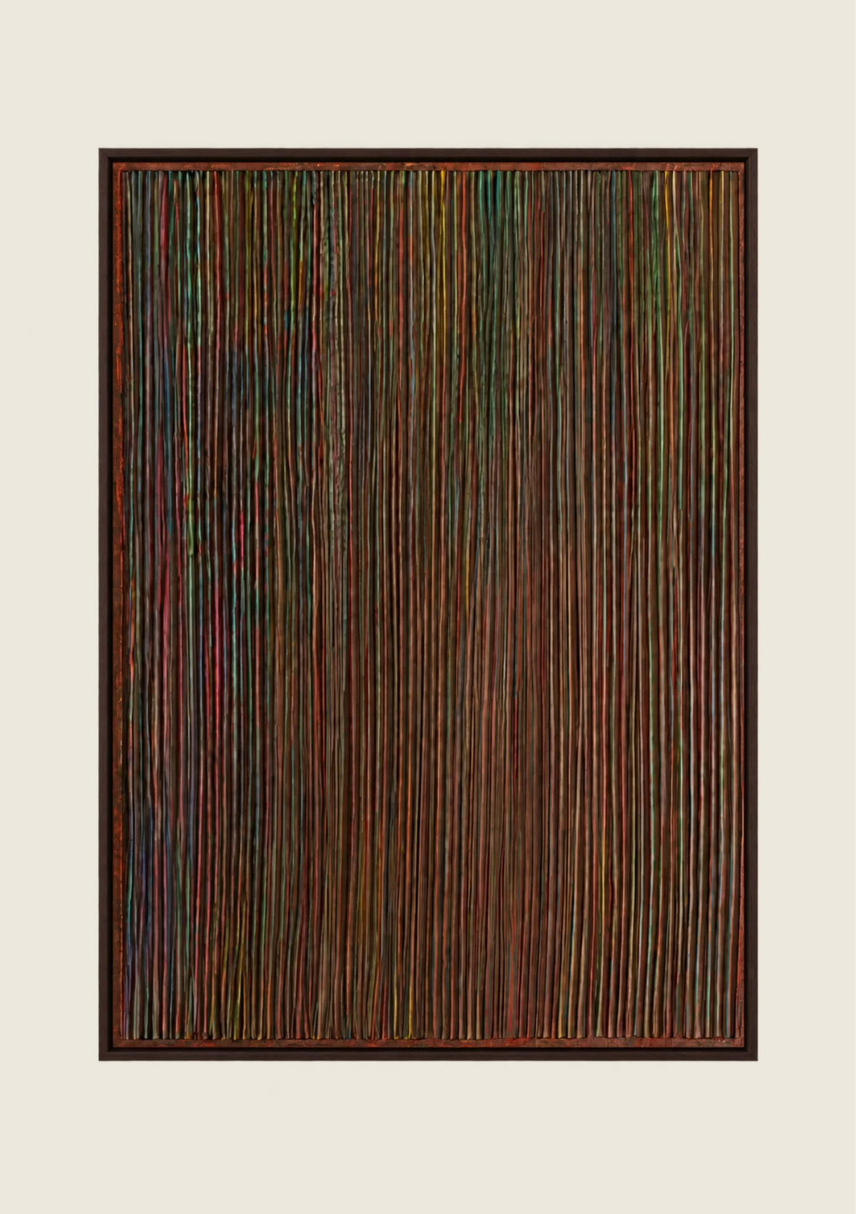 Strata, a textured abstract painting with fine vertical raised lines in dark green, burgundy, bronze and earthy tones, framed in dark wood.